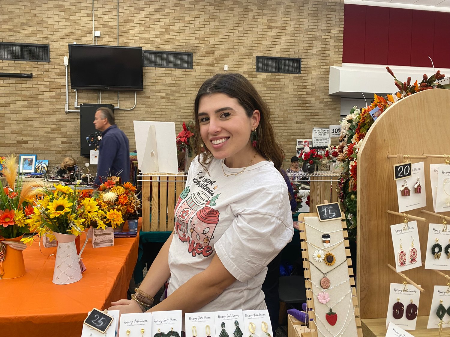 Nancy Joli Decor shows off some of her amazing earrings for sale at the fair. She makes floral wreaths, polymer clay jewelry and wooden home decor. Follow her on Instagram at @NancyJoliDecor.